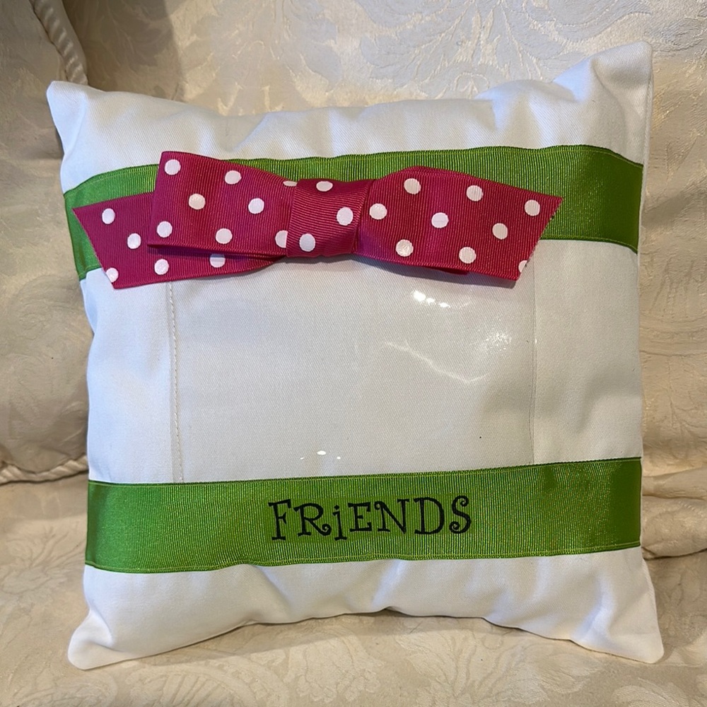 White Accent Pillow with Pink Polka Dot Bow and Green Ribbon 'FRiENDS' Detail.